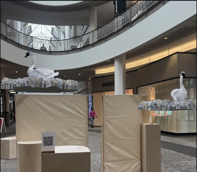 Exhibition — swan sculptures and QR code pedestal